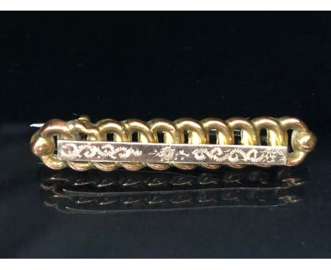 Gold coloured bar brooch stamped M&J to reverse approx 40mm in length