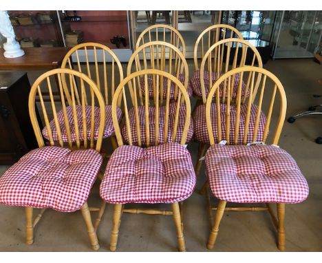 Furniture, set of 8 modern light wood Windsor spindle back dining chairs with red check material seat cushions.
