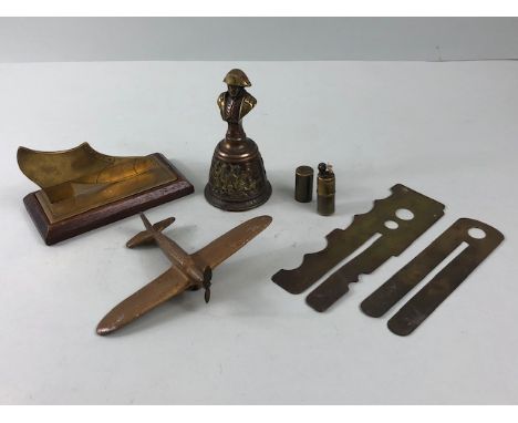 Military Interest , a group of  military related items being a shoe cut from shell case brass, a Napoleon bell , 2 button sti