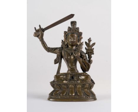 Himalayan Art. A dark bronze figure of Manjusri (Wenshu) China, Qing dynasty, late 18th century . Cm 13,00 x 16,00. 
