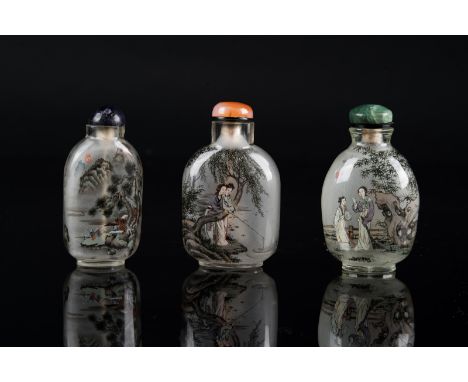 Chinese Art. Thee interior painted glass snuff bottles with stoppers  China, 19th century . Two of them painted with ladies i