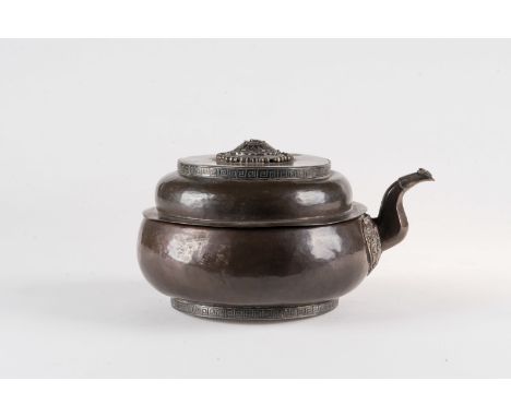 Himalayan Art. A copper and silver embossed teapot  Tibet, 19th century . Cm 11,00 x 20,00. 