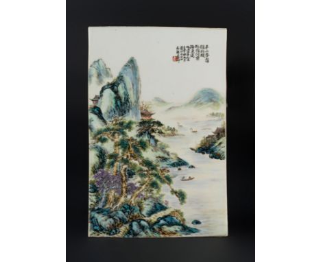 Chinese Art. A porcelain plaque painted with fishermen in landscape and bearing an inscription and seal on the upper right co