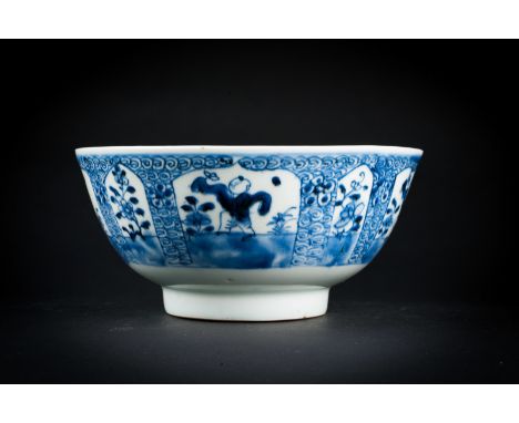 Chinese Art. A blue and white porcelain bowl painted with children and flowers and bearing a seal mark at the base  China, Qi