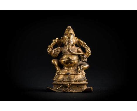 Indian Art. A gilt bronze figure of Ganesh  Southern India, Vijayanagar period, 17th century. Cm 5,50 x 7,50. 