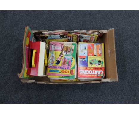 A box of Fisher Price music box record player together with a quantity of comics, cartoon books, commando etc 