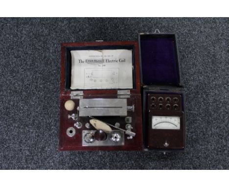 A vintage Ever Ready electric coil in fitted box together with a cased test meter 