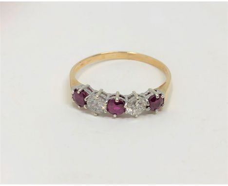 An 18ct gold five stone ruby and diamond ring, size P