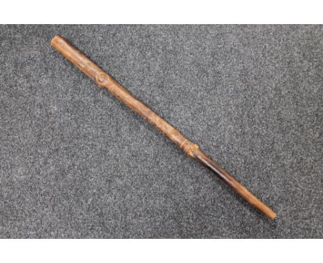 A carved tribal walking stick 