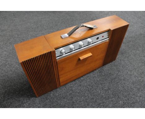 A Ferguson Stereo minor 3025 record player with drop down deck and detachable speaker 