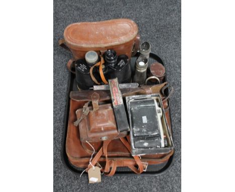 A tray of leather vintage satchel, cameras, case, binoculars, cut throat razors etc 