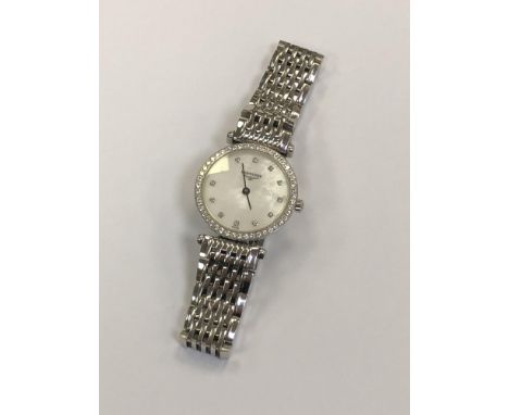 A lady's Longines La Grande Classique wristwatch with diamond set bezel and mother of pearl and diamond dial