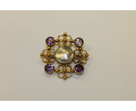 An amethyst and pearl gold brooch
