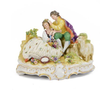 German lace figure group, modelled as a courting couple upon a naturalistically modelled base with gilt scroll edge, further 