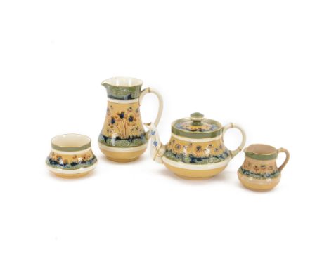 William Moorcroft for James Macintyre & Co Florian Ware tea service, in poppy pattern, comprising teapot, hot water jug, milk