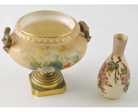 A Royal Worcester twin handle urn, decorated with flowers on a pink blush ground, H. 10cm, together with another small vase. 