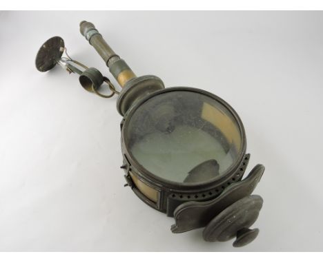 A large brass carriage lamp, of circular form with beveled clear glass panels, H. 66cm.