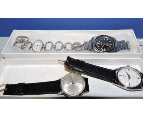 A Tissot stainless steel gentleman's wristwatch, a Henri Sandoz stainless steel wristwatch, one other and a ladies watch.