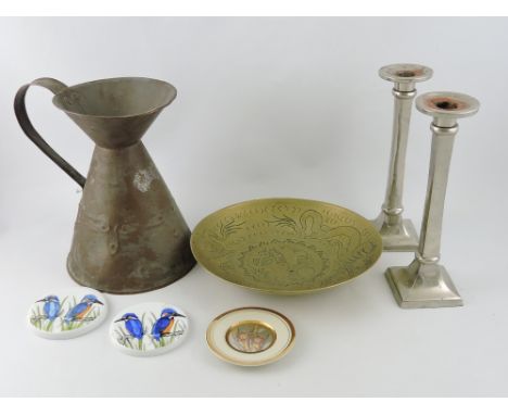 A copper water jug of conical form, together with a Chinese brass dish, two candlesticks and three ceramic discs.(5)