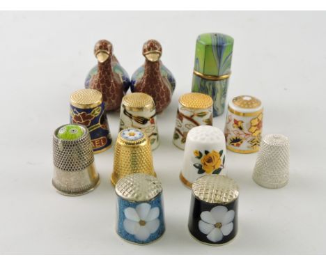 A white metal thimble, together with a small collection of others in ceramic and enamel and two cloisonne ducks, (12)