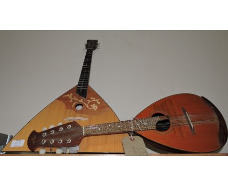 A 20th Century Marque lute with parquetry back together with an Ozark Romanian balalaika 