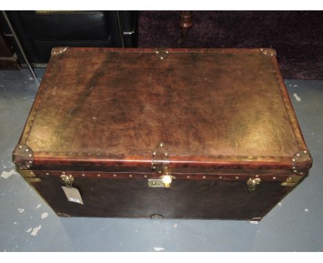 A Globetrekker style brass studded tan leather two handled trunk, L. 90cm.