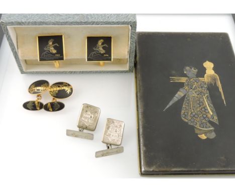 A 20th century Japanese cigarette case, rectangular decorated with a figure on a black ground, together with three pairs of c