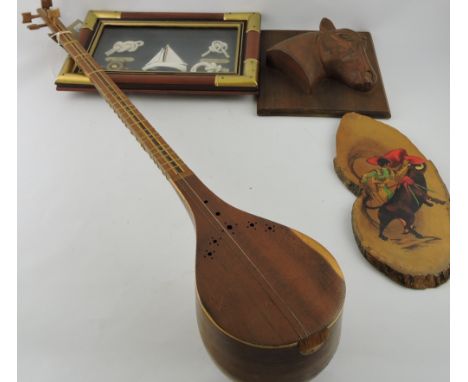 A 20th century Persian hardwood lute, together with a framed group of knots, a horse head plaque and a Spanish decorative pai