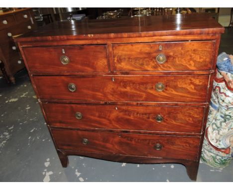 A George III mahogany chest fitted short and three long drawers on bracket feet, W. 104cm.