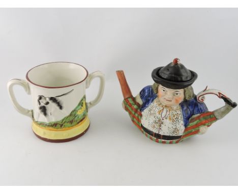 A 19th century Staffordshire twin handled 'frog' mug, decorated with hunting dogs, H. 14cm, together with a 19th century Toby