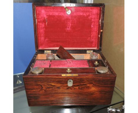 A Victorian mother of pearl inlaid rosewood travelling toilet box with plate mounted compartmented interior
