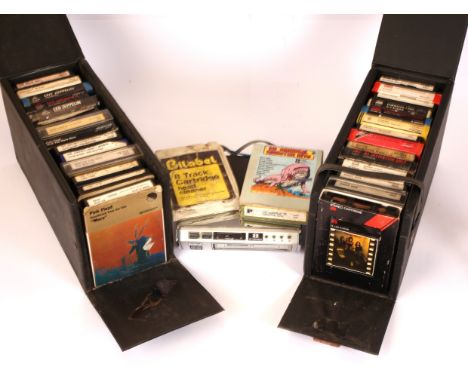 Collection Of 8 Track Cassettes And 8 Track Player. 2 cassette storage cases containing a total of 29 cassette albums. Includ