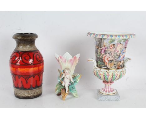 KPM porcelain vase, mounted with putti, stamped to base, 14cm high, together with a West German pottery vase, and a Capodimon