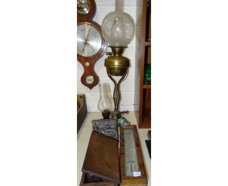 A brass oil lamp on shaped stand with quadruped support, with etched glass globe shade (a/f), 73cm high, a cranberry glass ha