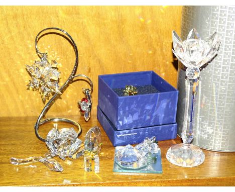 A Swarovski glass flower candlestick, 19.5cm high, (with box), a metal Christmas display stand with three hanging ornaments, 