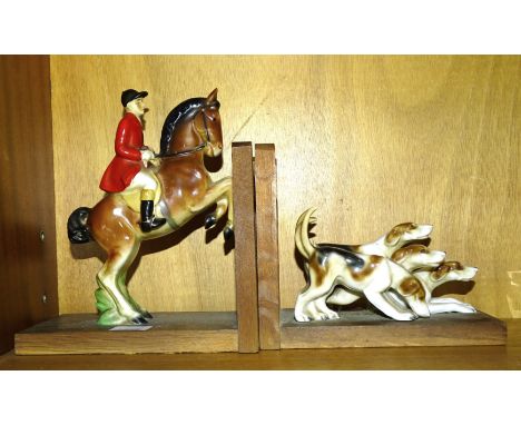 A pair of hunting theme bookends, comprising a rider and hounds, mounted on oak gate frames, 19cm, 9cm high. 