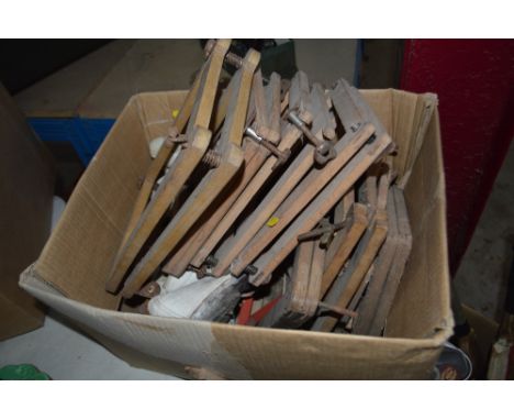 Two boxes of vintage sporting equipment including tennis rackets, cricket bats, table tennis bats etc.