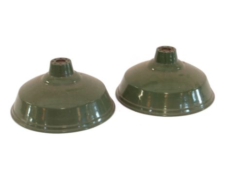 A pair of vintage green and enamel ceiling light shades