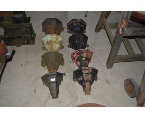 Eight vintage cast iron rain water hoppers
