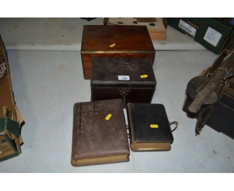 A Georgian mahogany tea caddy, a Victorian walnut and brass bound writing box and two Edwardian photograph albums