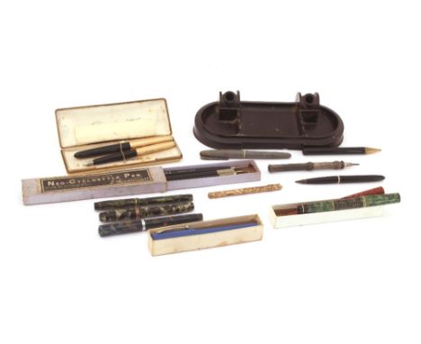 A Bakelite desk stand and a box of various vintage fountain pens etc.