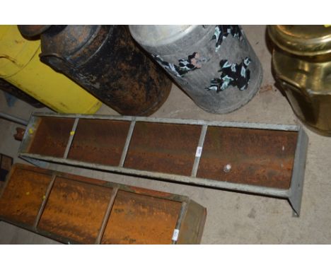 An old galvanised four section pig trough 