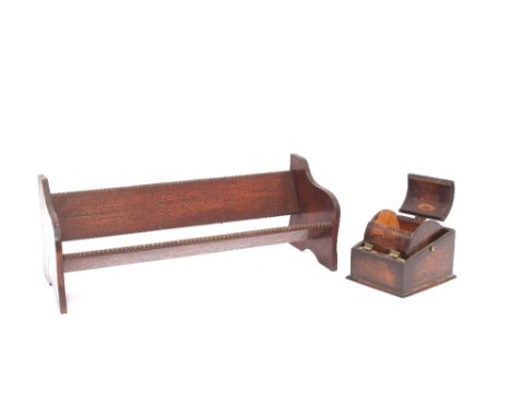 A 1930's oak book trough and a cigarette dispenser