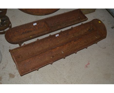 A long cast iron two section pig trough  AF