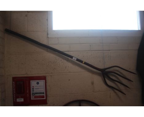 A four tine rustic branch fork