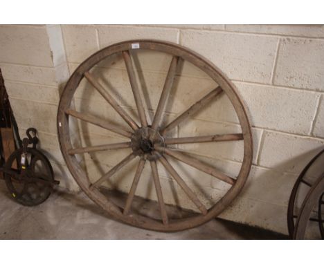A vintage cart wheel with iron rim