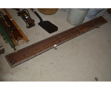 A long cast iron pig trough 