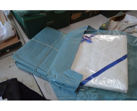 A quantity of vintage patterned hemmed sheets, in original packaging and unused