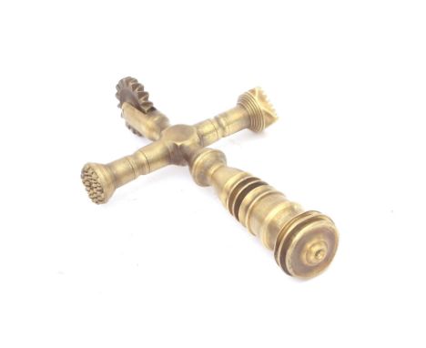 An Antique brass pastry tool