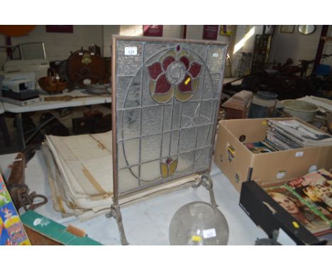 An Art Nouveau coloured and leaded glass panel fire screen, AF